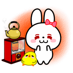 The white rabbit with ribbon in winter